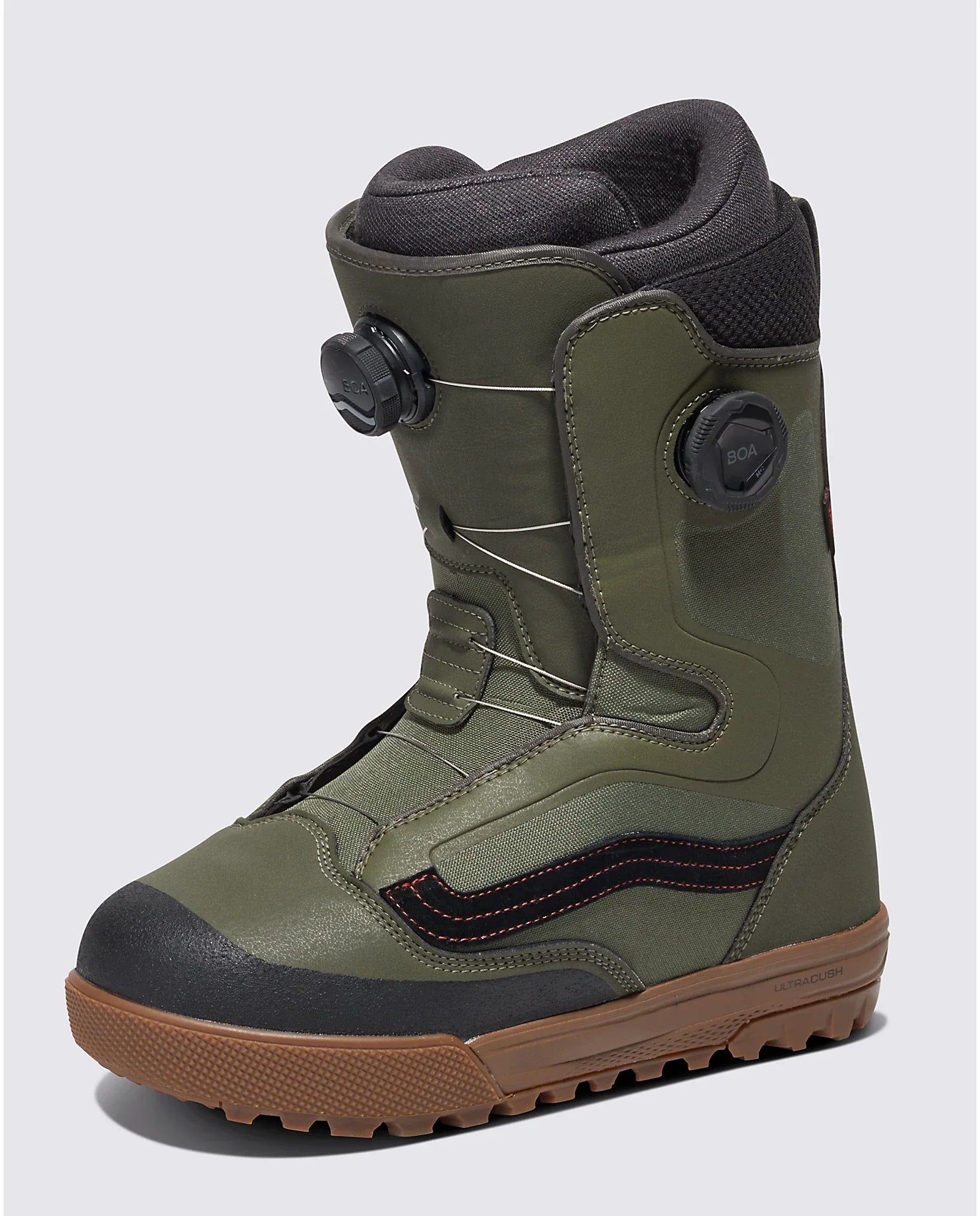 Vans Aura Pro Snowboard Boot 2024 - A green snowboard boot with a black stripe on the side and red stitching, featuring a brown sole.