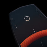 Hyperlite Baseline Wakeboard 2024 - A black wakeboard with a red stripe and white logo on top.