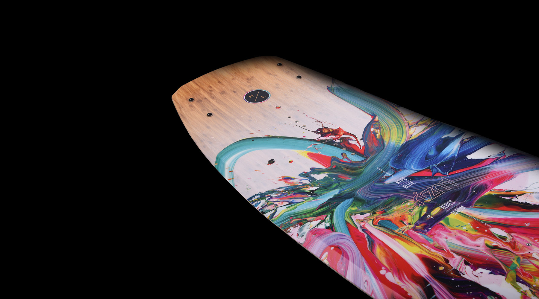 Hyperlite Women's Prizm Wakeboard 2024 - A white wakeboard with a blue and pink abstract design on its top side.