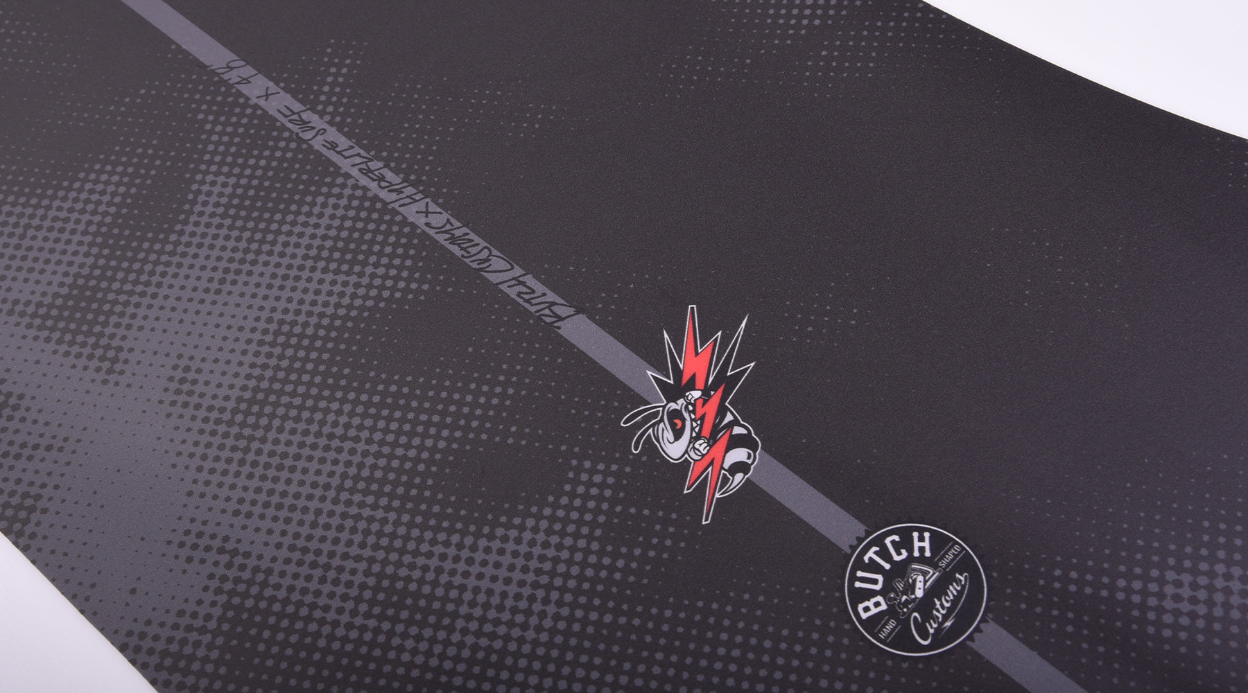 Hyperlite Buzz Wakesurf Board 2024 - A black wakesurf board with a white logo and red lettering on its top side.