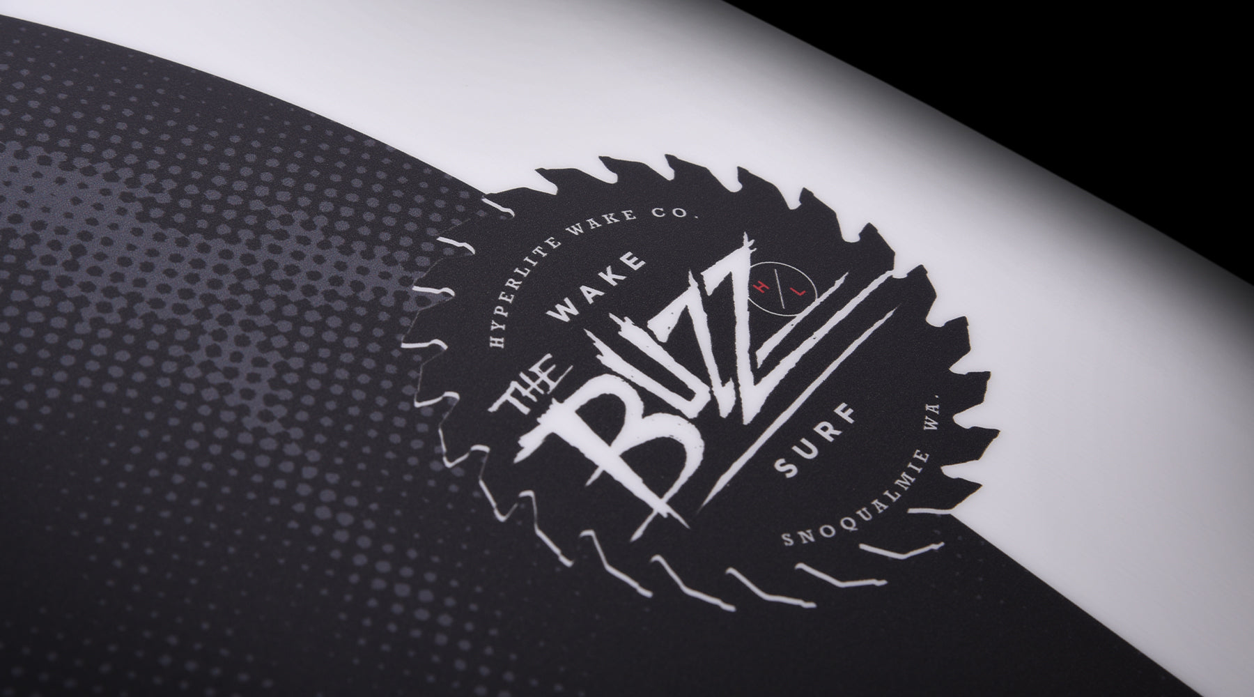 Hyperlite Buzz Wakesurf Board 2024 - A black wakesurf board with a white logo and red lettering on its top surface.
