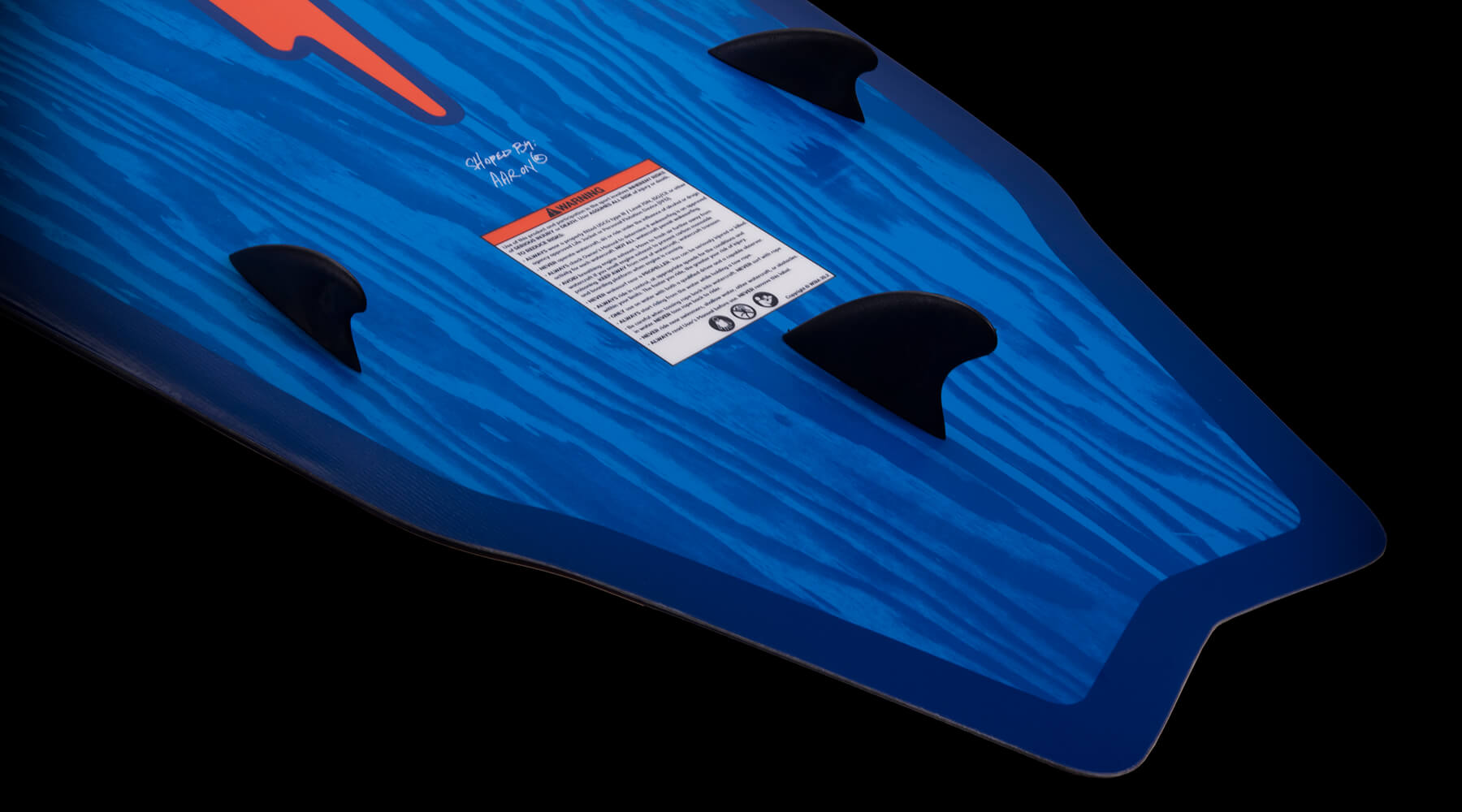 Hyperlite Landlock Wakesurf Board 2024 - A blue wakesurf board with a red logo on top and black fins at the bottom.