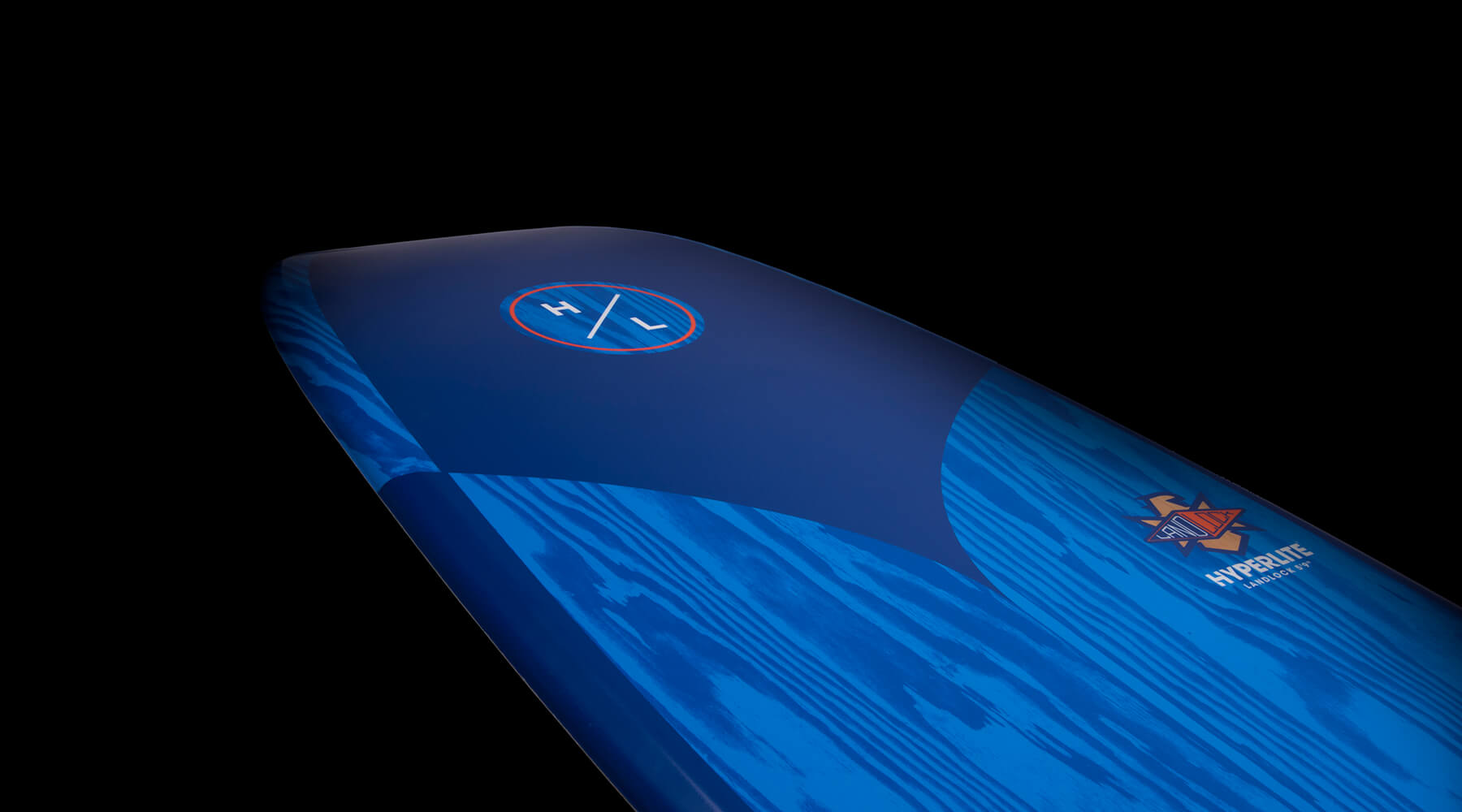 Hyperlite Landlock Wakesurf Board 2024 - A blue wakesurf board with a white logo featuring an orange outline and the letters "HL" in the center.