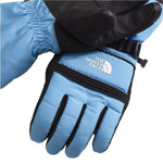 North Face Women's Montana Glove - A pair of gloves with a light blue palm and black fingers, featuring a white logo on the wrist strap.