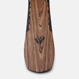 Jones Women's Flagship Snowboard 2024 - A snowboard with a black and white logo on its top, featuring a mountain range design.