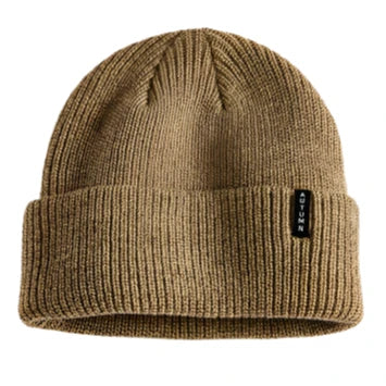 Autumn Select Beanie 2025 - A tan beanie with a small black tag on the front.