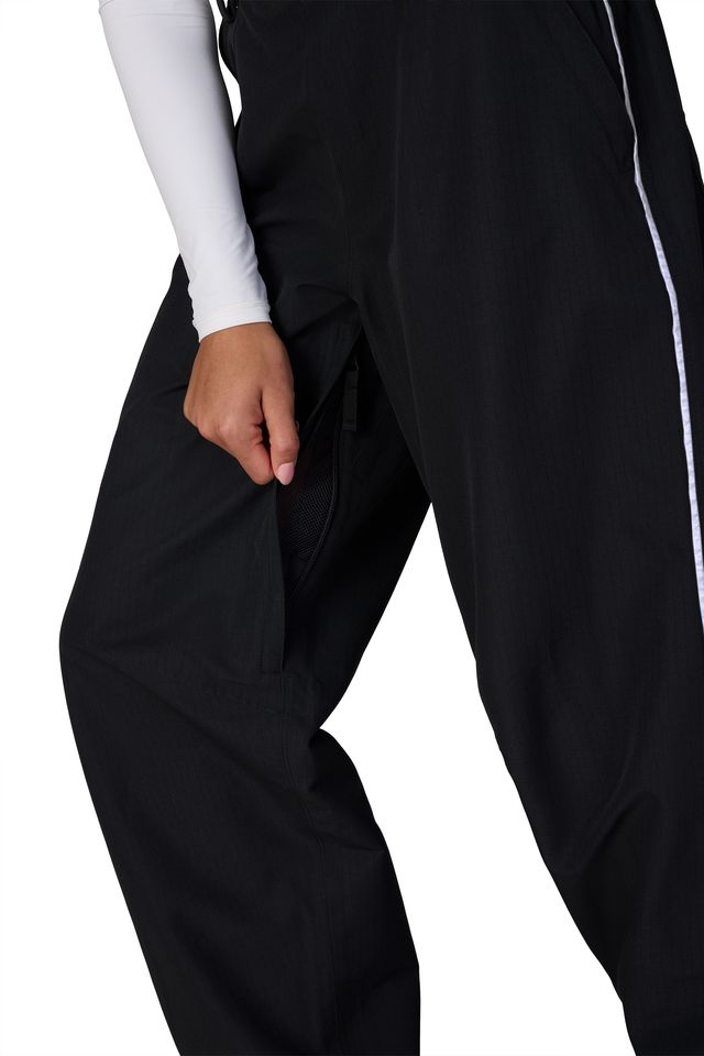 Black shell pants with side pocket and relaxed straight legs