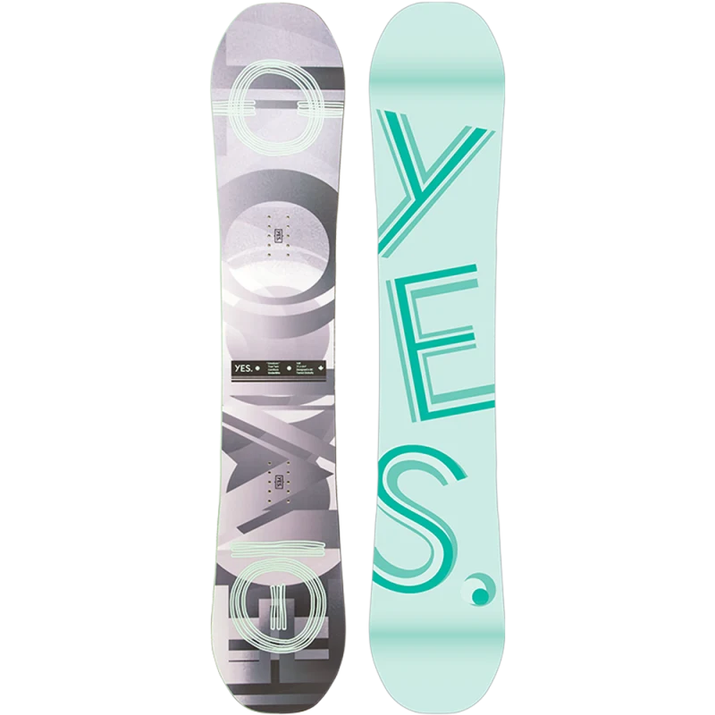 The Yes Emoticon Women's Snowboard 2023 is shown in light blue with large mint green letters spelling 'YES' running vertically down the center.