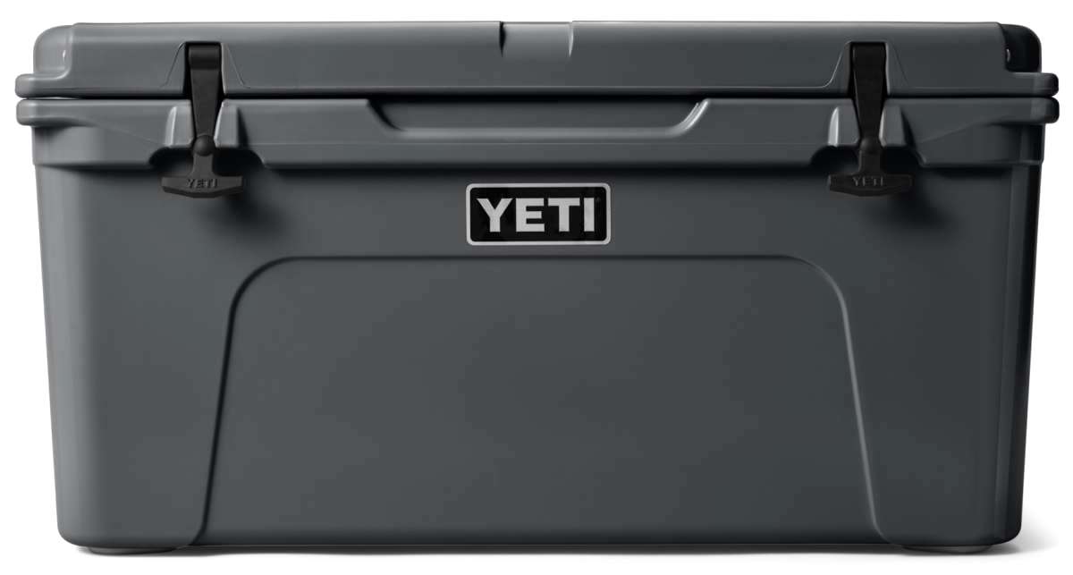 Yeti Tundra 65 Cooler - A large, rectangular cooler with a dark gray lid and matching body, featuring a handle on top and a logo in white lettering.