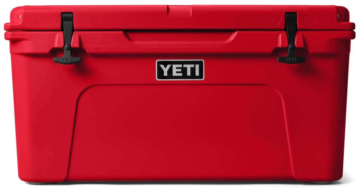 Yeti Tundra 65 Cooler - A large, red cooler with a handle on top and two latches on either side of it.