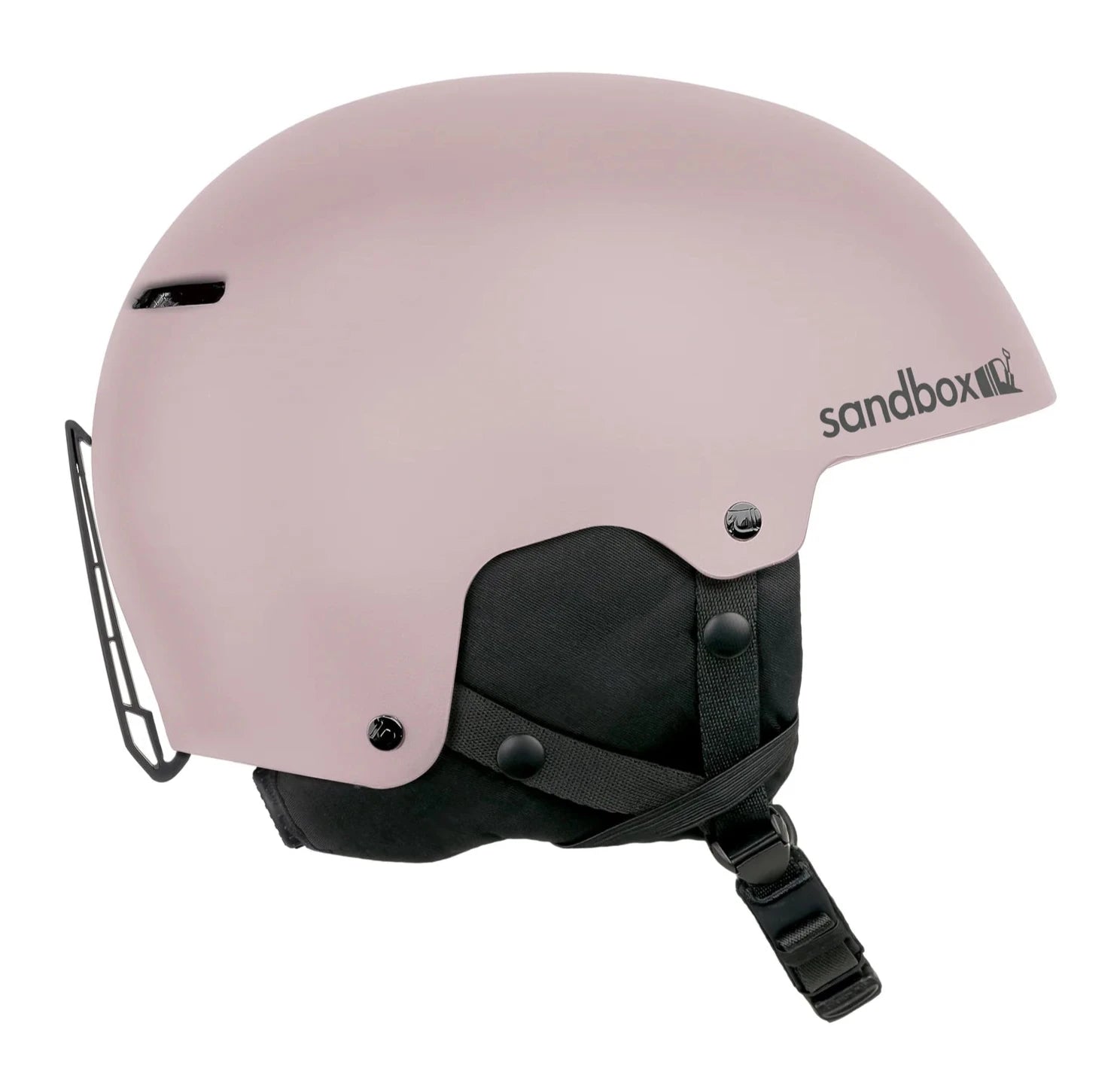 Sandbox Junior's Icon Snow Helmet 2025 - A light pink helmet with a black chin strap and ventilation holes on top.
