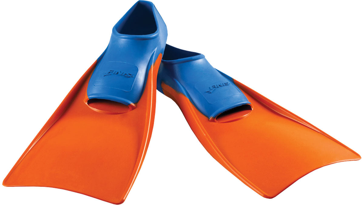 Finis Junior's Long Floating Swim Fins - These bright orange fins have a distinctive blue strap with "FINIS" embossed on it, and are viewed from the side.