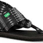 Sanuk Ladies' Yoga Sling 2 Prints Sandal - A black and white houndstooth patterned sandal with a green logo on the strap.