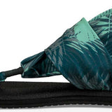 Sanuk Ladies' Yoga Sling 2 Prints Sandal - A green and grey palm leaf print sandal with a strap that wraps around the big toe.