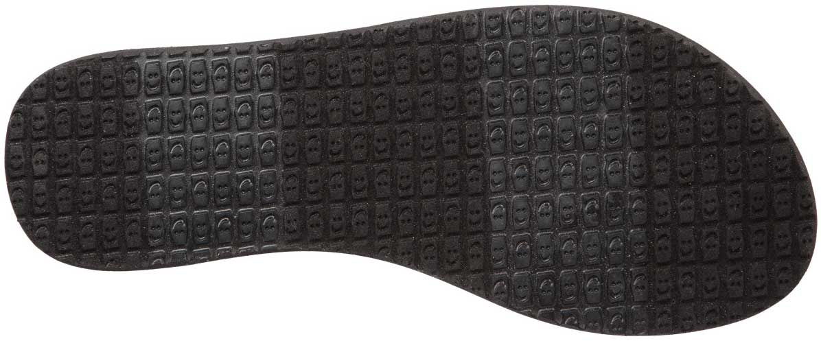 Sanuk Ladies' Yoga Sling 2 Prints Sandal - Black sandal with a repeating pattern of small, stylized faces on the footbed.