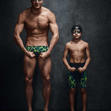 Speedo Jr. Vanquisher 2.0 Swim Goggle - A pair of black swim goggles with dark gray lenses and a white logo on the strap.