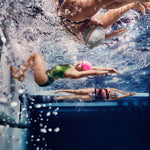 Speedo Jr. Vanquisher 2.0 Swim Goggle - A pair of black swim goggles with red and white accents on a gray background.