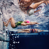 Speedo Jr. Vanquisher 2.0 Swim Goggle - A pair of black swim goggles with red and white accents on a gray background.