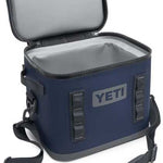 Yeti Hopper Flip 12 Personal Cooler - A navy blue cooler with a zippered lid and two handles, one on each side.