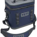 Yeti Hopper Flip 12 Personal Cooler - A navy blue cooler with a zippered top and two handles, featuring the word "YETI" in gray on one side.