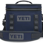 Yeti Hopper Flip 8 Personal Cooler - A navy blue cooler with a zippered top and two handles, featuring the word "YETI" in gray on one side.