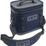Yeti Hopper Flip 8 Personal Cooler - A navy blue cooler with a zippered lid and two handles, featuring a gray logo on one side.