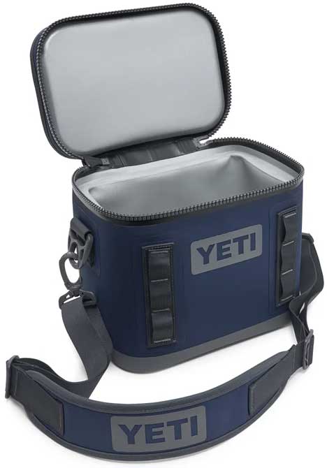 Yeti Hopper Flip 8 Personal Cooler - A navy blue cooler with a zippered lid and two handles, one on each side.