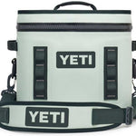 Yeti Hopper Flip 12 Personal Cooler - A light blue cooler with a zipper closure and two handles on top.