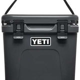 Yeti Roadie 24 Hard Cooler - A black cooler with a handle on top and two latches in front.