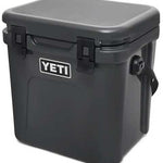 Yeti Roadie 24 Hard Cooler - A black, rectangular cooler with a handle on top and a latch in the middle.