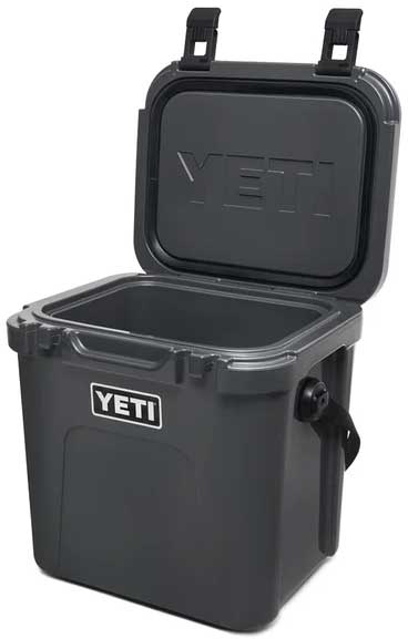 Yeti Roadie 24 Hard Cooler - A compact, portable cooler with a sleek design and a silver metal handle on top.