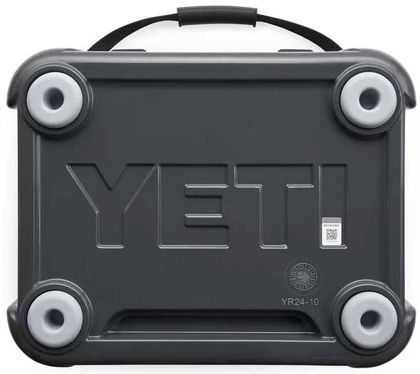 Yeti Roadie 24 Hard Cooler - A dark gray cooler with a handle on top and four round feet, featuring the word "YETI" embossed in large letters across its front.