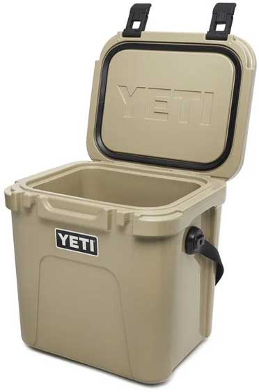 Yeti Roadie 24 Hard Cooler - A tan cooler with a black handle on the right side and a white logo that says "YETI" in all caps.