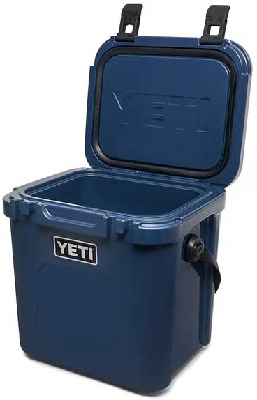 Yeti Roadie 24 Hard Cooler - A navy blue cooler with a black handle and latch on top, viewed from the front at an angle.