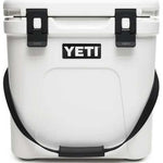 Yeti Roadie 24 Hard Cooler - A white, rectangular cooler with a handle on top and a latch in the middle.