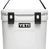 Yeti Roadie 24 Hard Cooler - A white cooler with a black handle on top and a black logo that says "YETI" in bold letters.