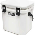 Yeti Roadie 24 Hard Cooler - A white, rectangular cooler with a flat top and rounded corners, featuring two black latches on its lid.
