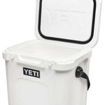 Yeti Roadie 24 Hard Cooler - A white cooler with a black handle on top and a small, rectangular logo that says "YETI" in bold letters.