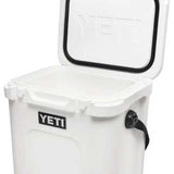 Yeti Roadie 24 Hard Cooler - A white cooler with a black handle on top and a small, rectangular logo that says "YETI" in bold letters.