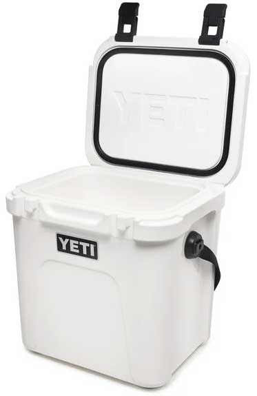 Yeti Roadie 24 Hard Cooler - A white cooler with a black handle on top and a small, rectangular logo that says "YETI" in bold letters.