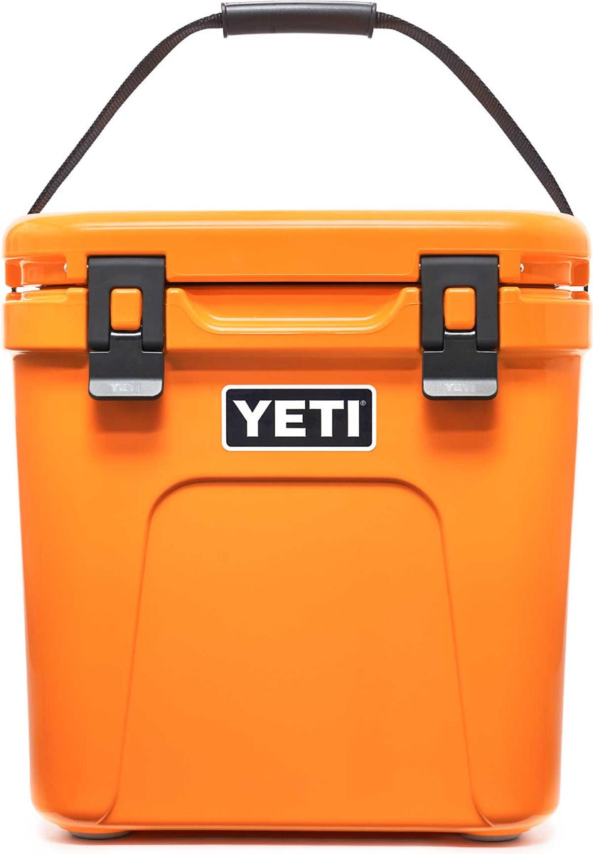 Yeti Roadie 24 Hard Cooler - A compact, portable cooler with a sleek design and a silver handle on top.