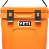 Yeti Roadie 24 Hard Cooler - A compact, portable cooler with a sleek design and a silver handle on top.