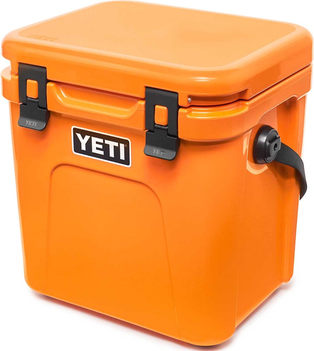 Yeti Roadie 24 Hard Cooler - A compact, portable cooler with a sleek design and a silver handle on top.