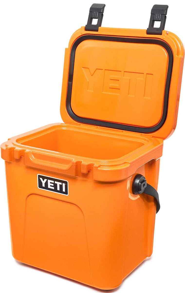 Yeti Roadie 24 Hard Cooler - A compact, portable cooler with a sleek design and a silver metal handle on top.