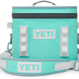 Yeti Hopper Flip 12 Personal Cooler - A light blue cooler with a zipper closure and two handles on top.