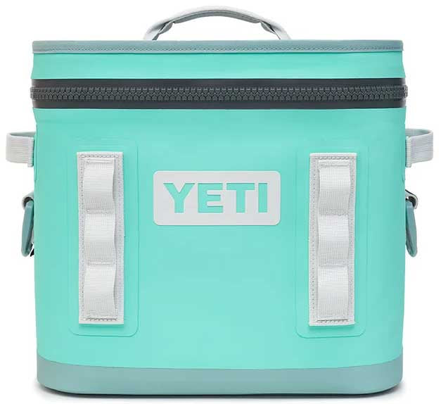 Yeti Hopper Flip 12 Personal Cooler - A light blue cooler with a zippered lid and two handles on either side, featuring a prominent "YETI" logo in white lettering on the front.