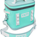 Yeti Hopper Flip 12 Personal Cooler - A mint green cooler with a zippered top and two white handles on either side.
