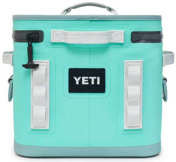 Yeti Hopper Flip 12 Personal Cooler - A mint green cooler with a black zipper and handle on top.