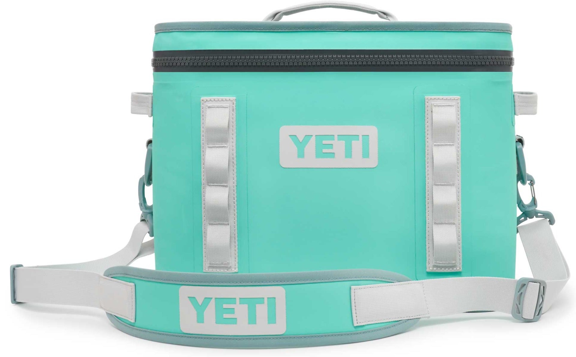 Yeti Hopper Flip 18 Personal Cooler - A mint green cooler with a zippered top and two handles, one on each side.