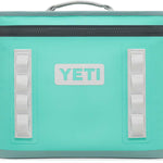 Yeti Hopper Flip 18 Personal Cooler - A cooler with a dark gray lid and handle, featuring a large logo in light blue on the front.